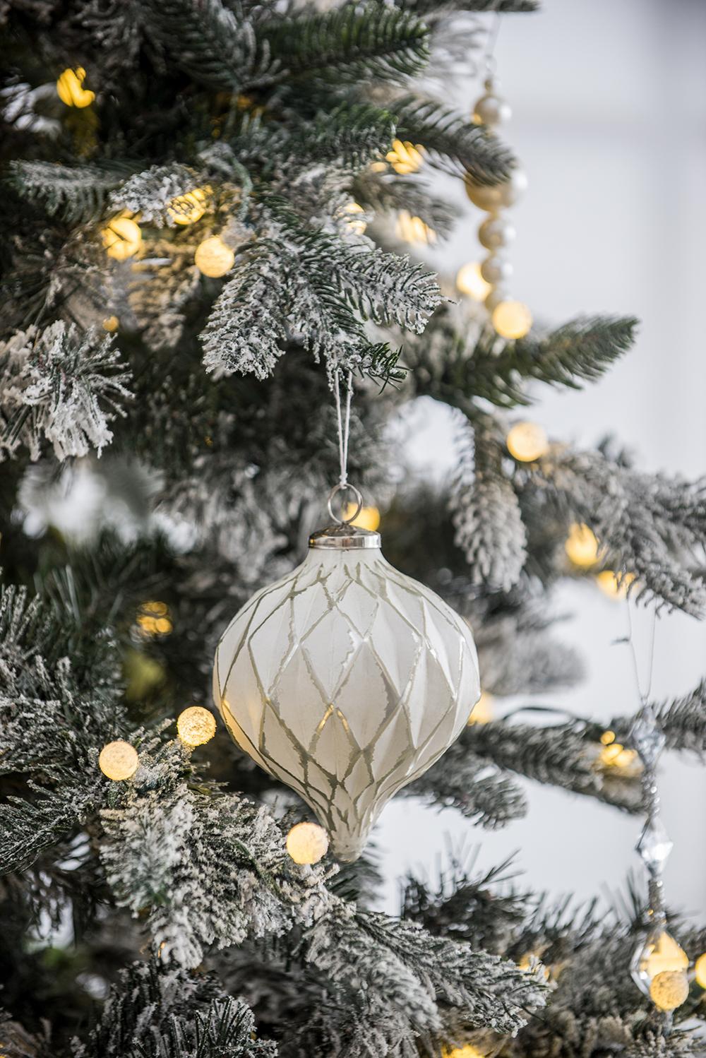 White glass Christmas ornament with diamond pattern