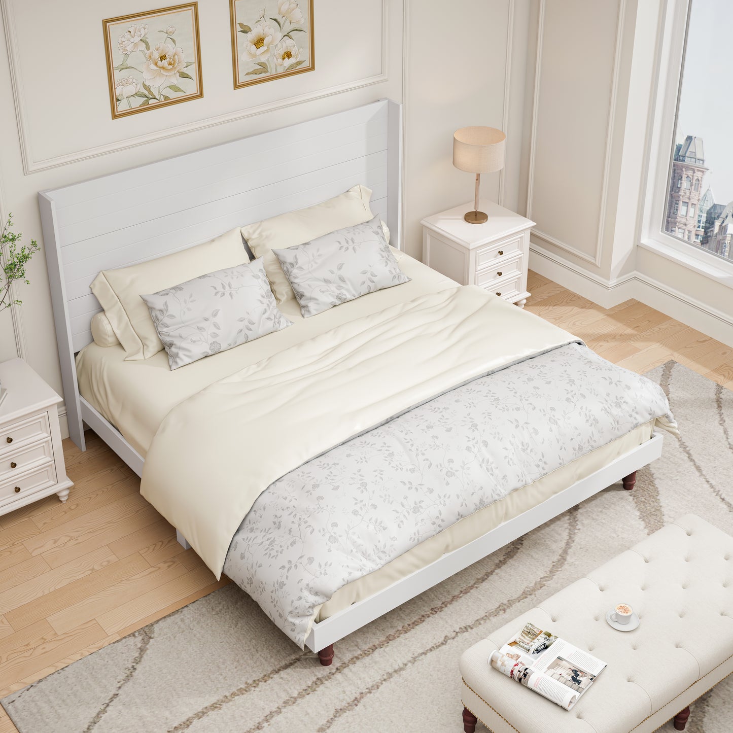 White modern platform bed with floral duvet and cream sheets