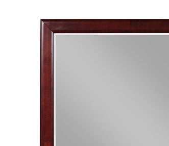 Closeup of a dark wood framed vanity mirror with a polished surface