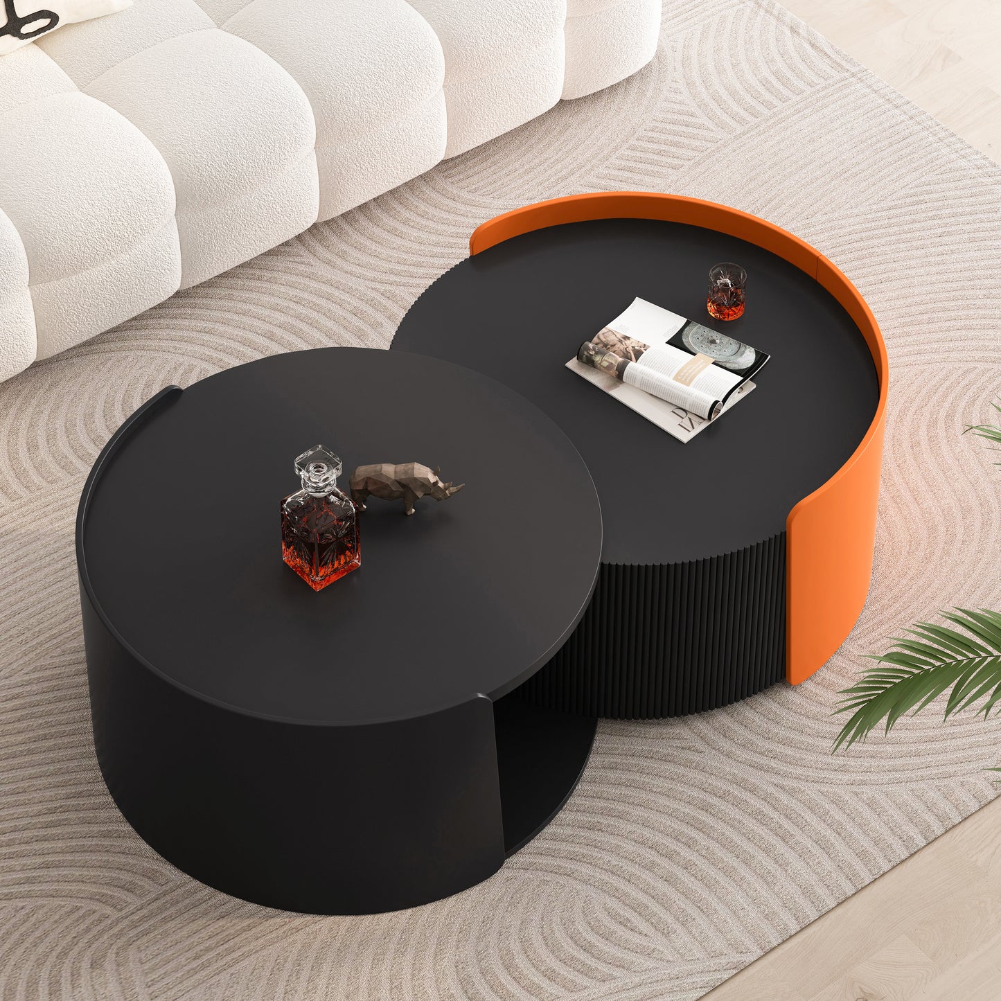 Modern black nesting coffee table with orange accent on rug