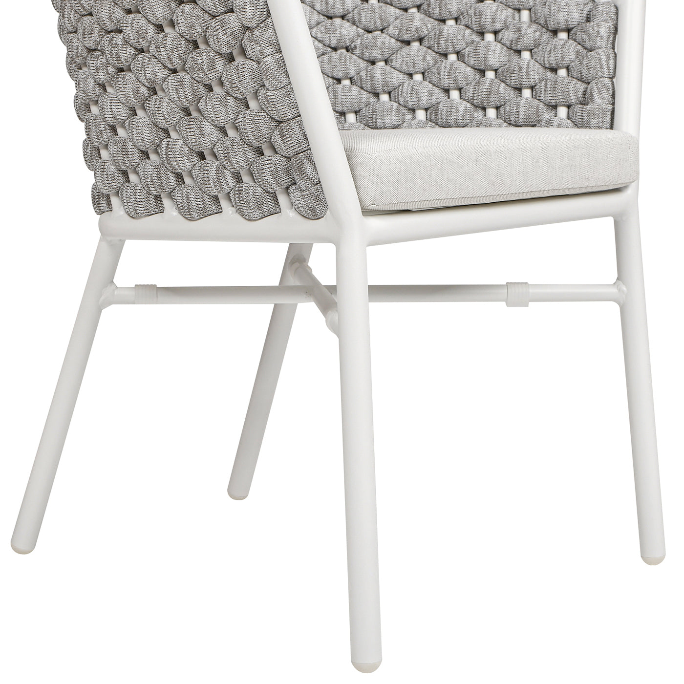 Close up of white metal chair legs and woven gray backrest with a light gray cushion