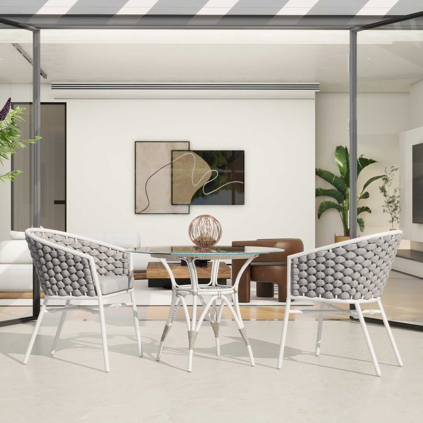 Modern outdoor dining set with a clear glass tabletop and white woven chairs