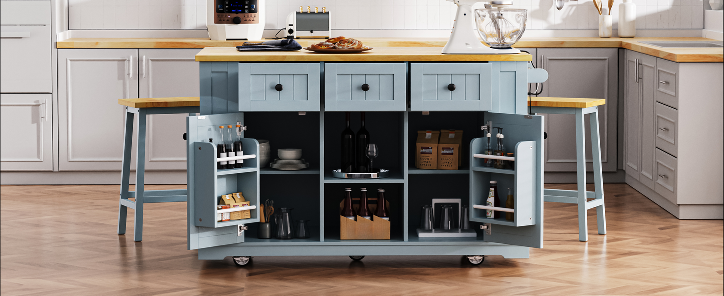 Powder blue kitchen island with butcher block top drawers and open shelving storing bottles and snacks