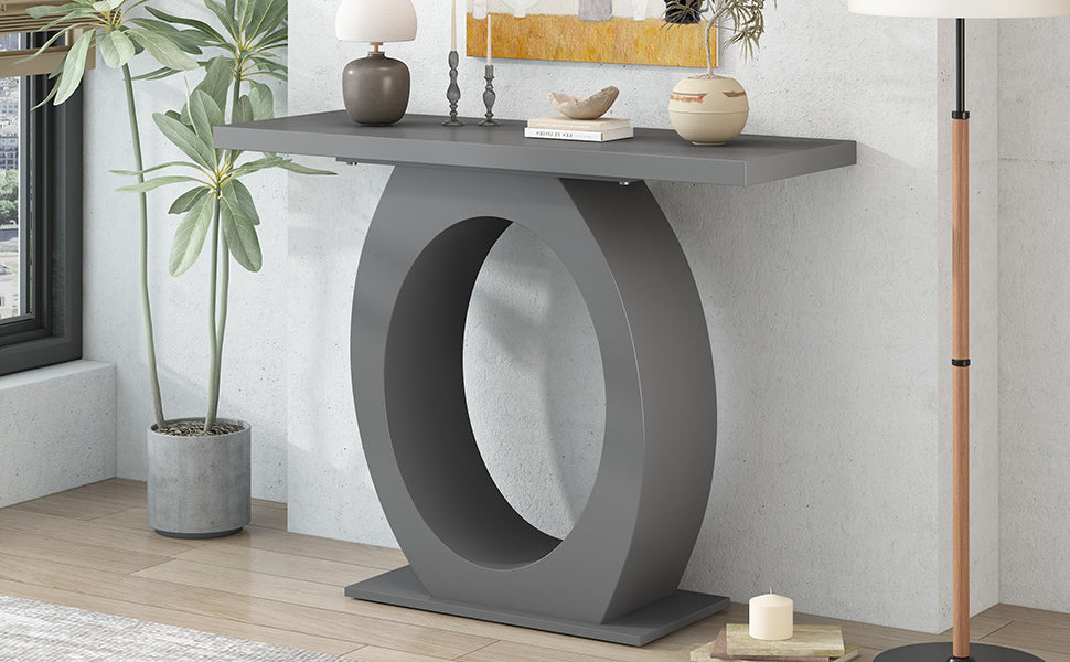 Modern grey console table with a striking oval pedestal base ideal for entryways