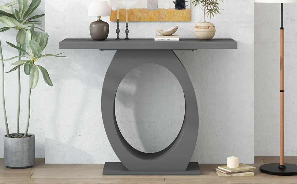 Modern gray console table with a unique oval pedestal base and sleek tabletop