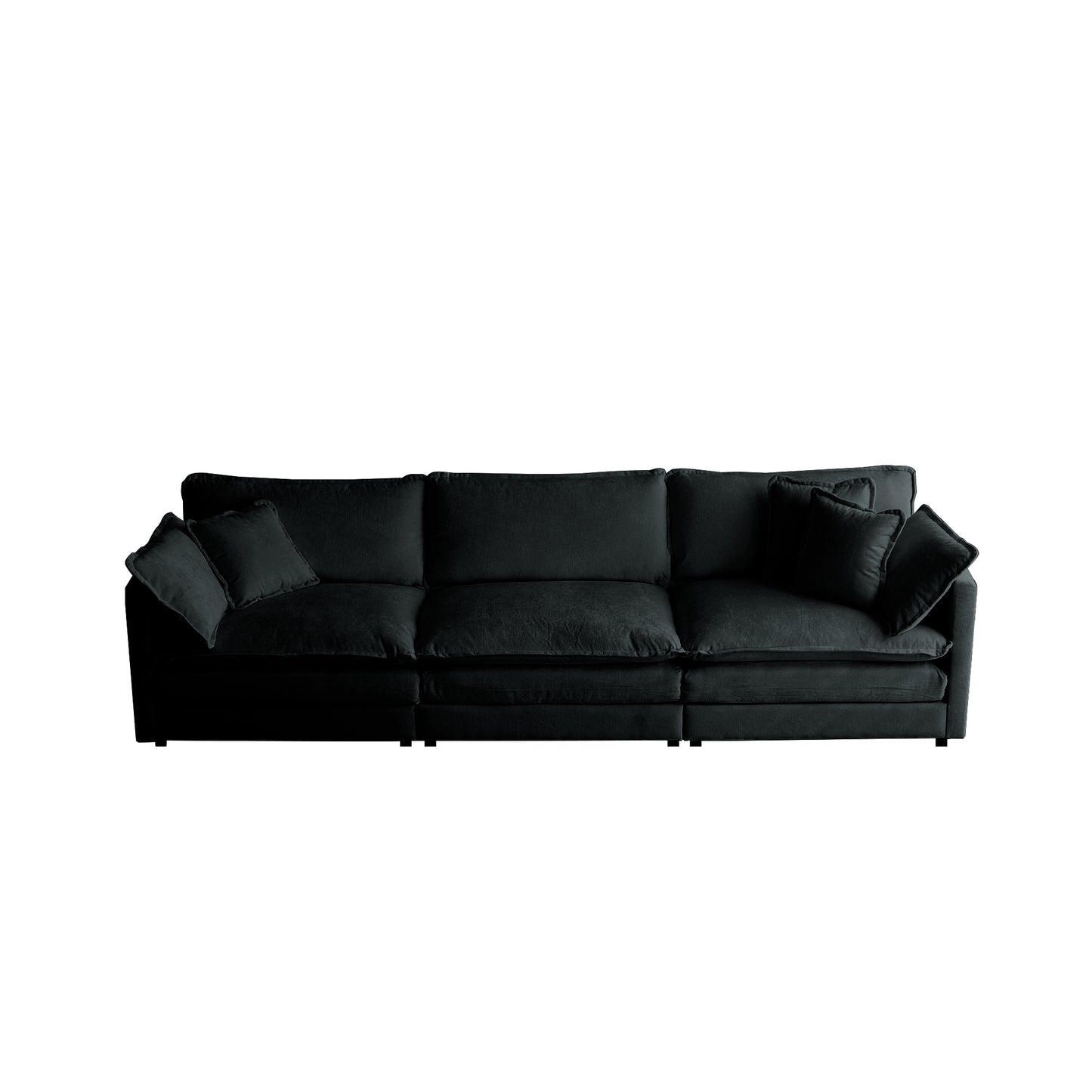 Deep black velvet sectional sofa with plush seat cushions and four accent pillows