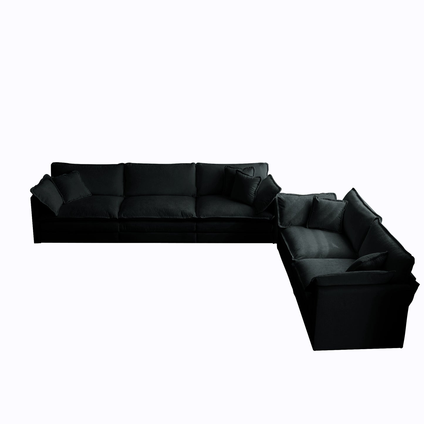 Plush black fabric sectional sofa with deep seating and scattered accent pillows