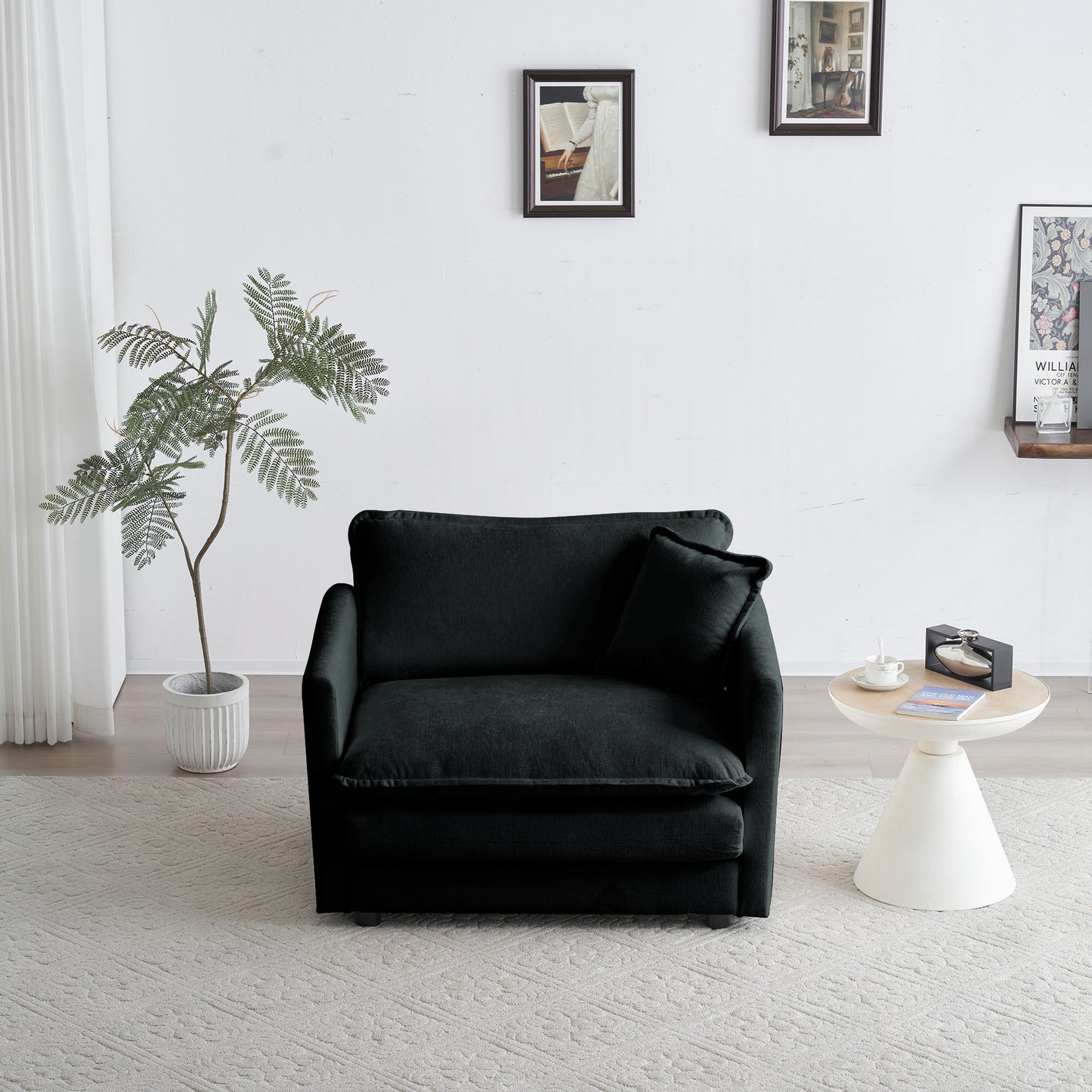 Plush dark charcoal velvet armchair with square armrests and lumbar pillow