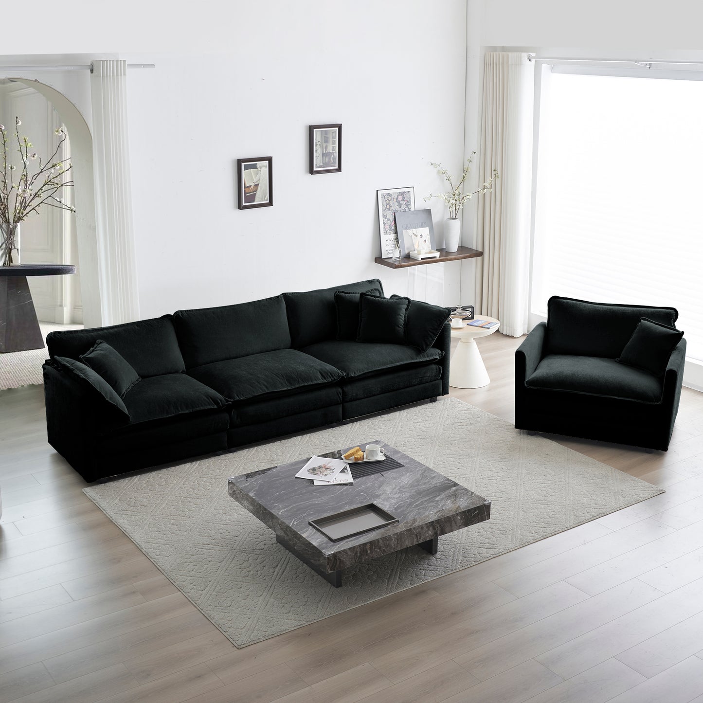 Deep black velvet sectional sofa with plush cushions and matching throw pillows