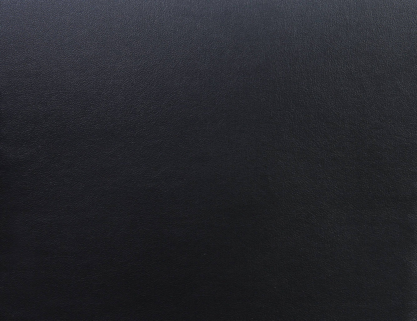 Closeup of textured black faux leather material perfect for upholstery or accessories