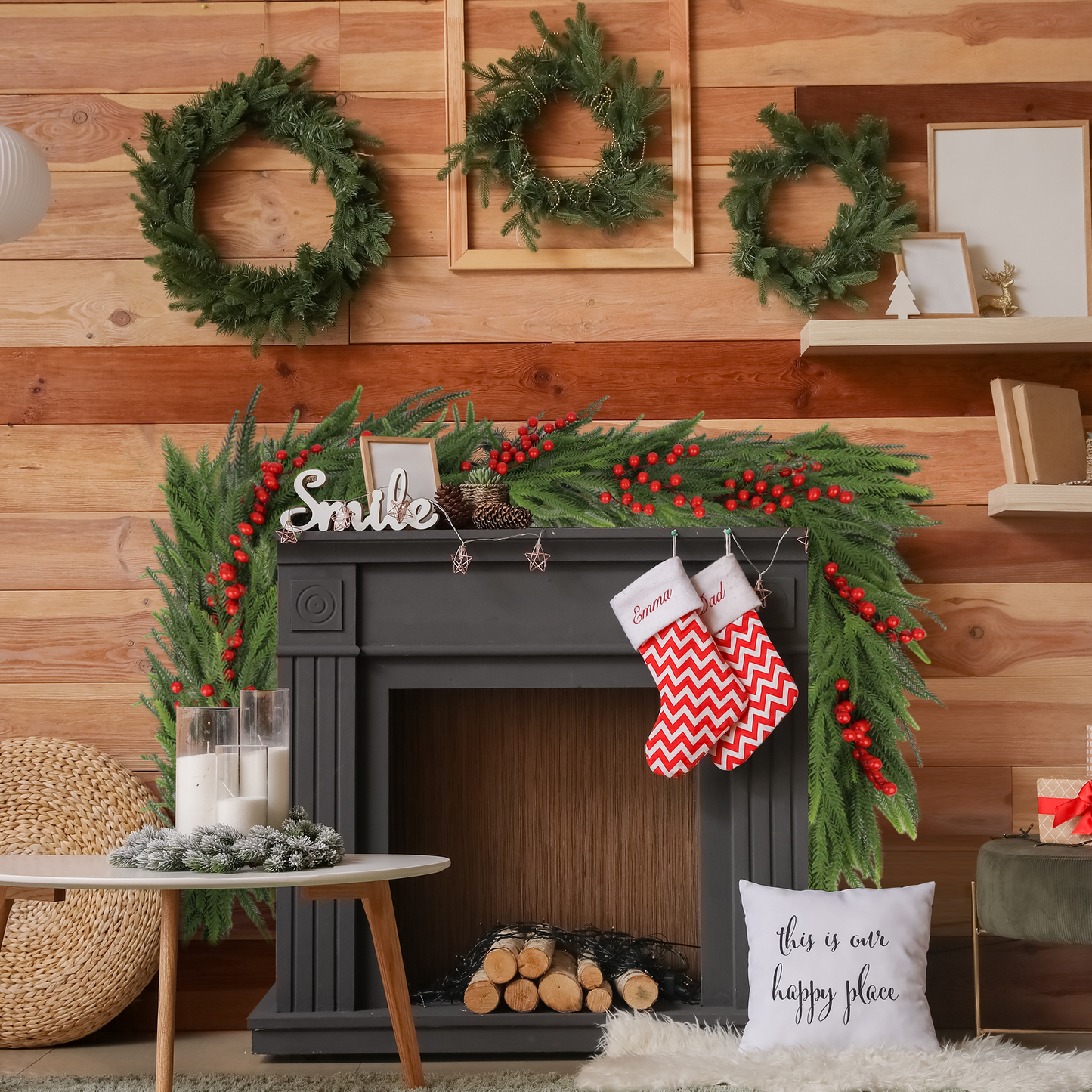 Green pine garland with red berries draped over a festive fireplace
