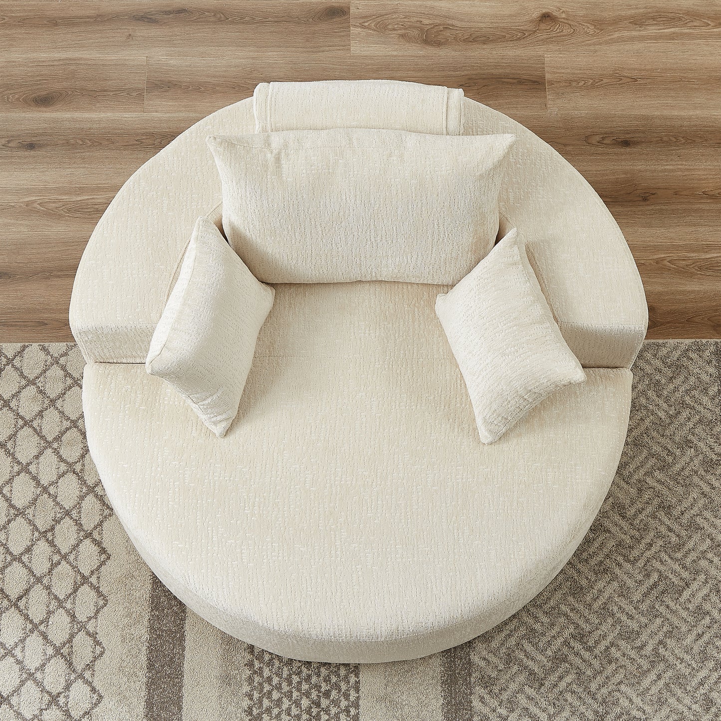 Cream textured circular sofa with accent pillows perfect for modern living rooms
