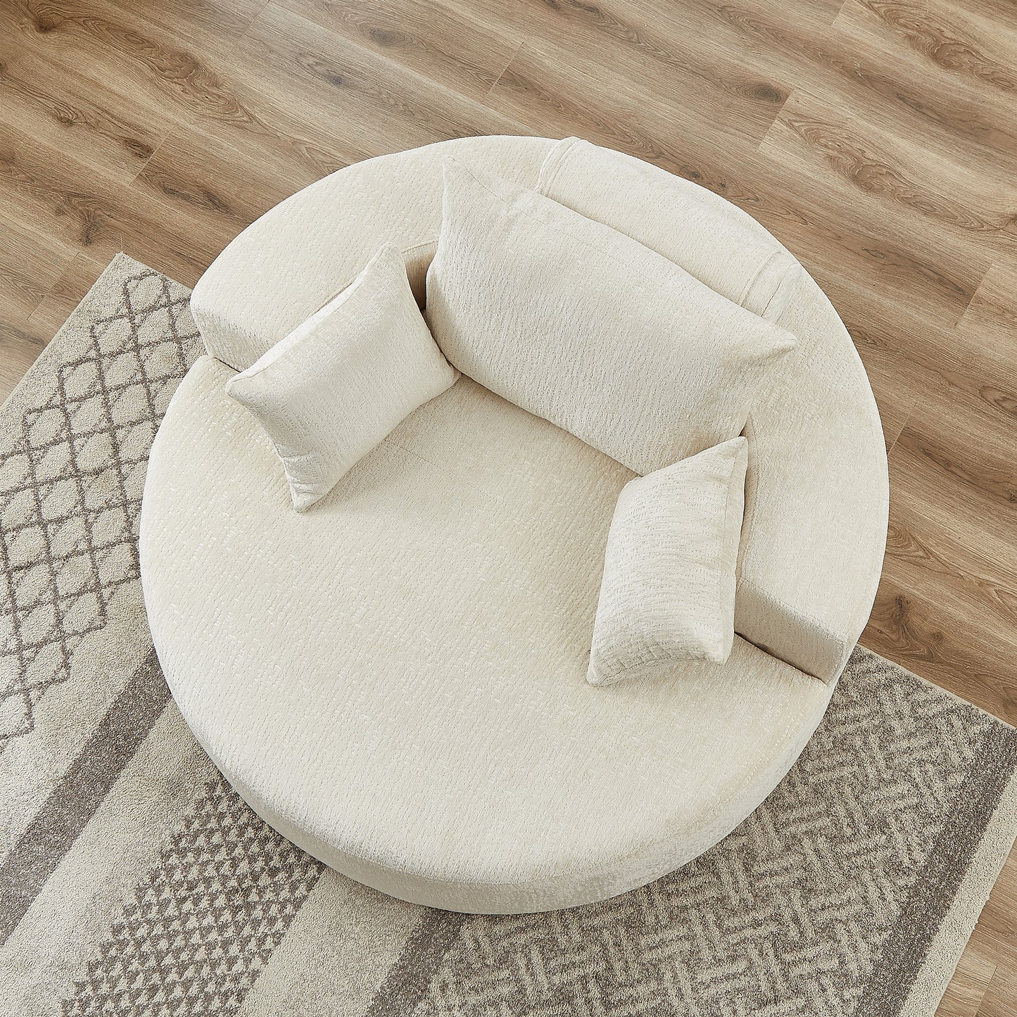 Plush cream circular sofa with textured fabric and matching throw pillows modern living room furniture