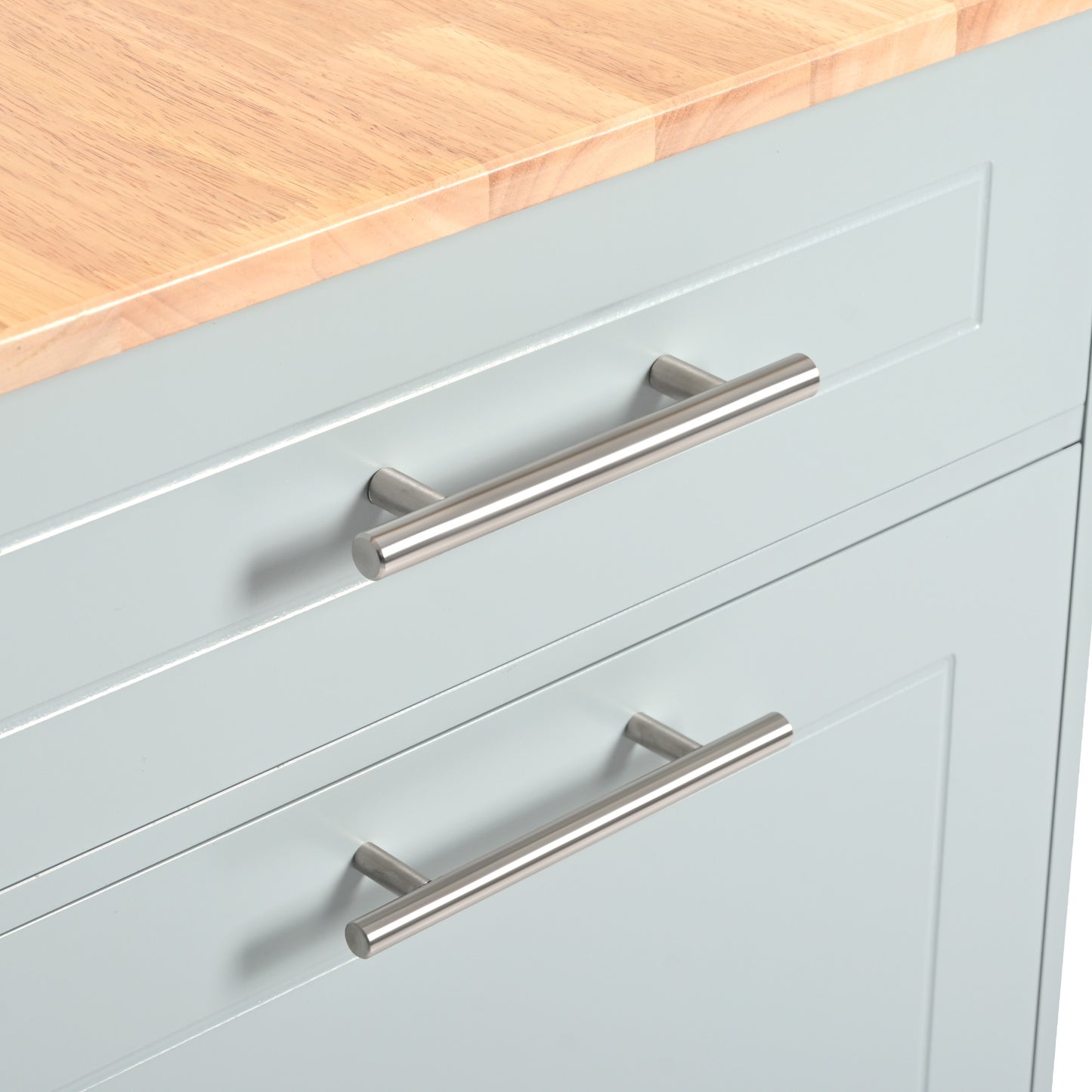 Closeup of light blue cabinet doors with silver bar handles and a wooden top