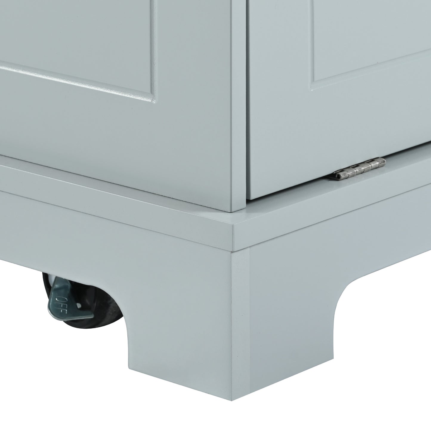 Closeup of a light blue cabinet corner with silver caster wheel lock labeled OFF