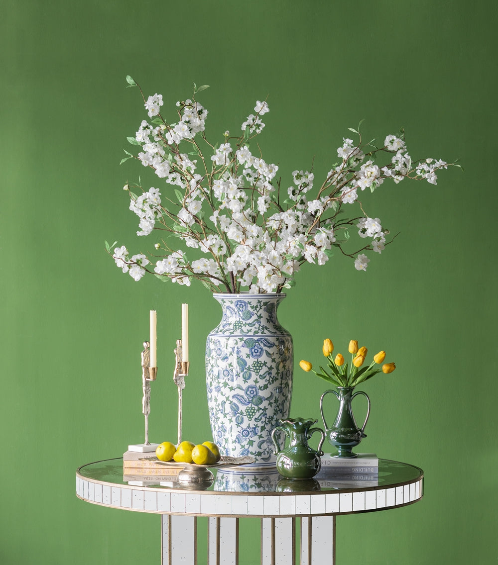 Tall blue and white chinoiserie vase with white cherry blossoms