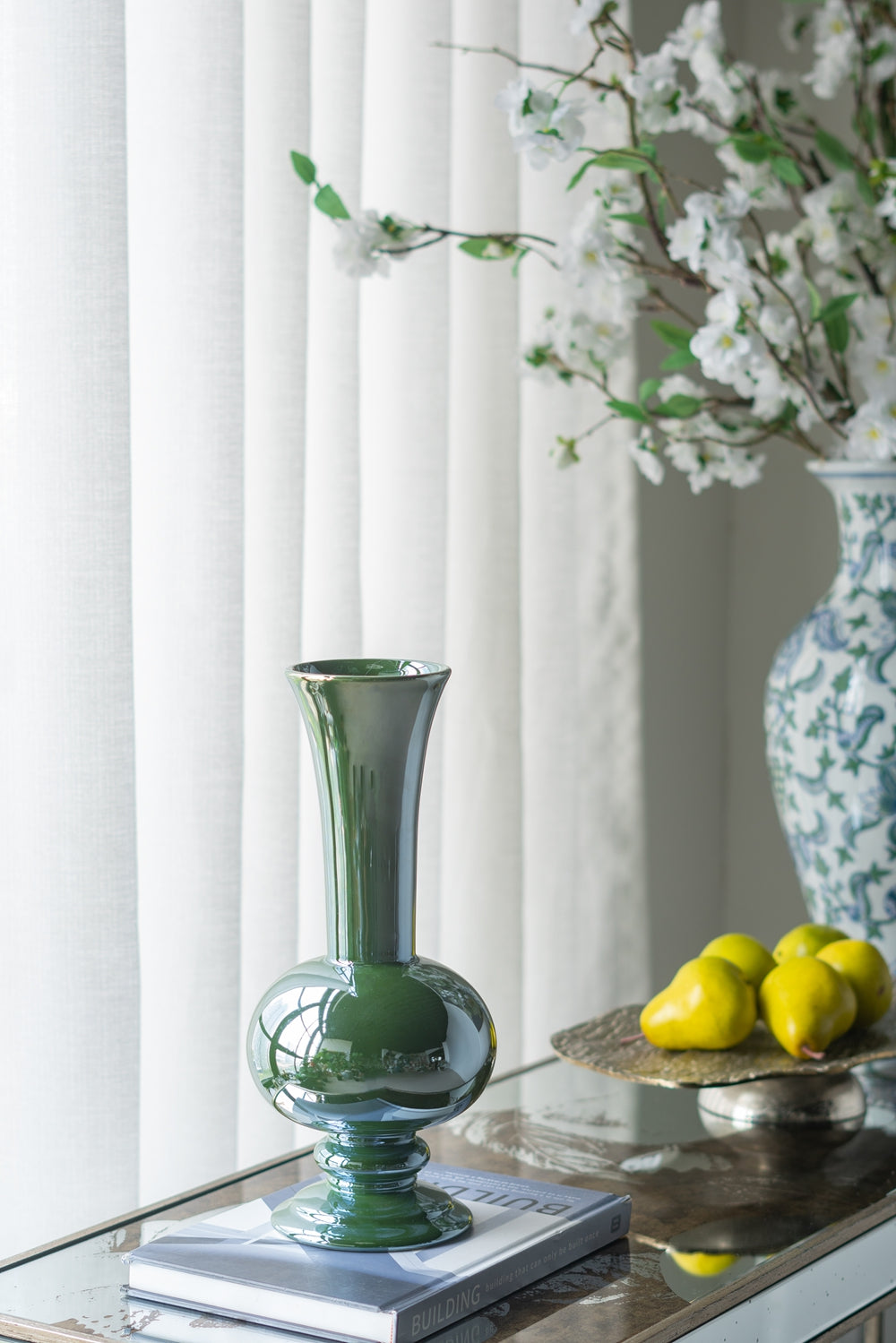 Shiny dark green ceramic vase with a bulbous base and flared neck elegant home decor accent