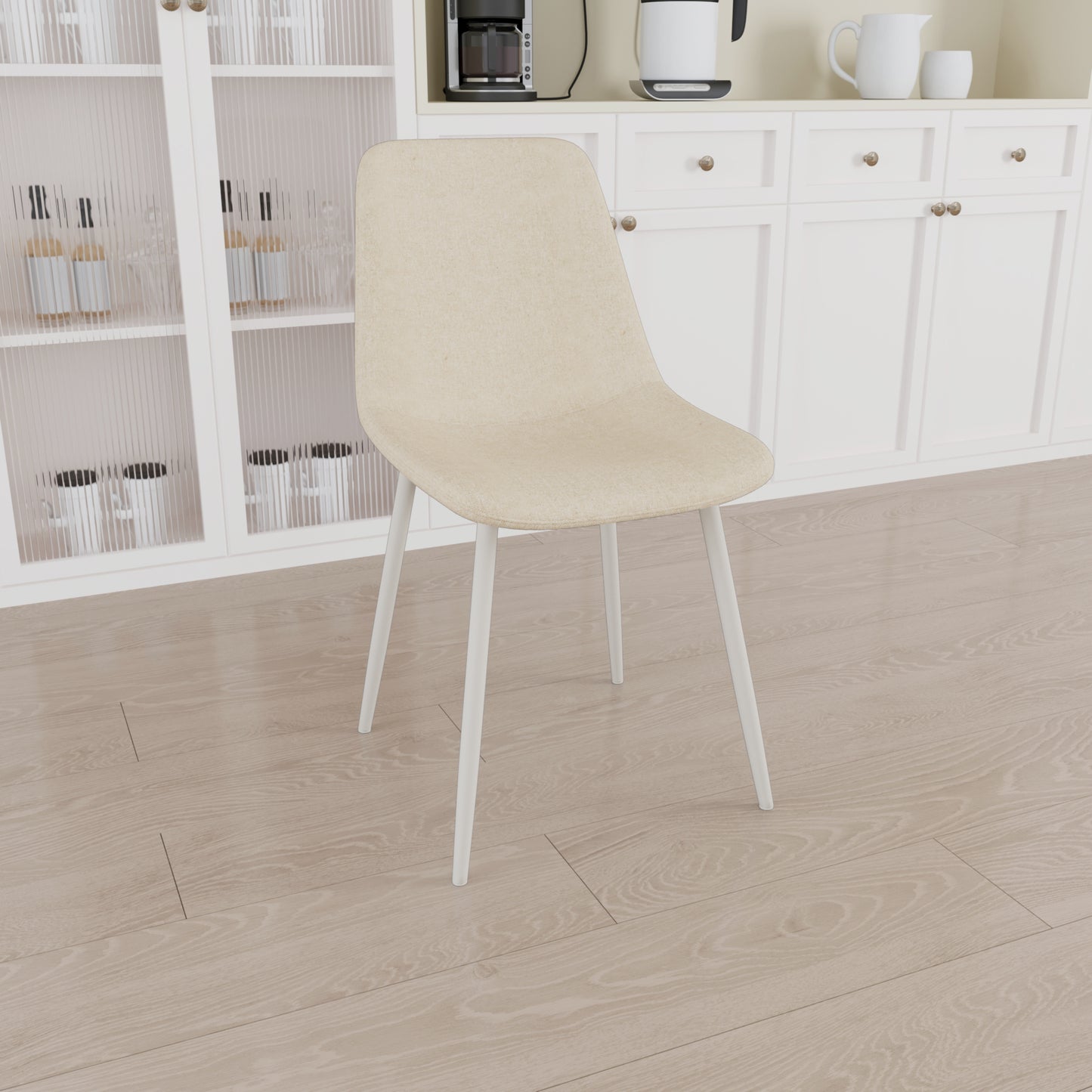 Cream fabric dining chair with white metal legs ideal for a modern kitchen