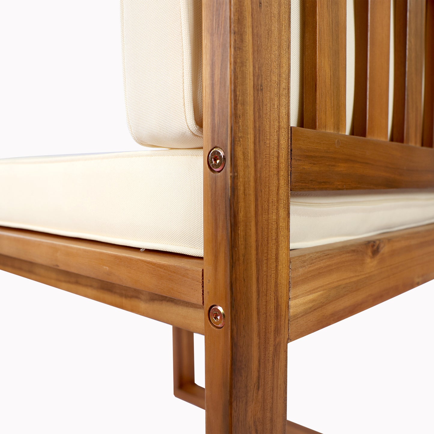 Closeup of natural wood armchair frame with cream cushions modern outdoor seating
