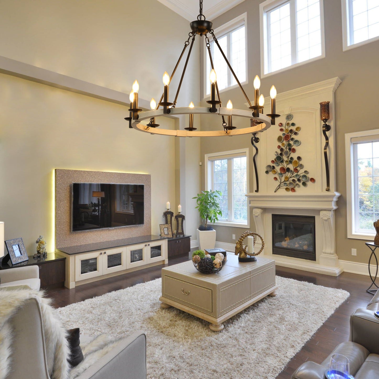 Rustic farmhouse chandelier with a distressed wood ring and black metal accents illuminating a living room