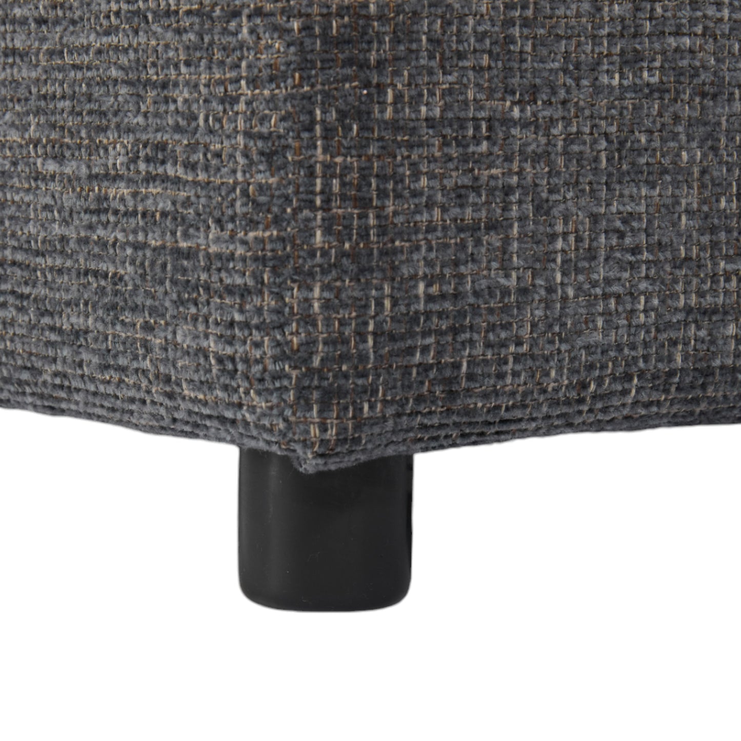 Closeup of textured charcoal gray fabric on a modern furniture leg