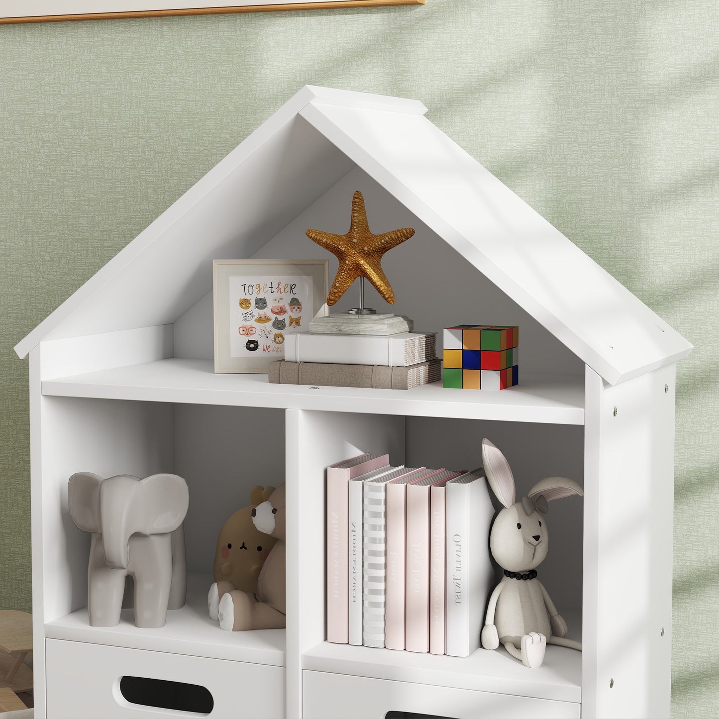White houseshaped bookshelf with cute animal art starfish and books