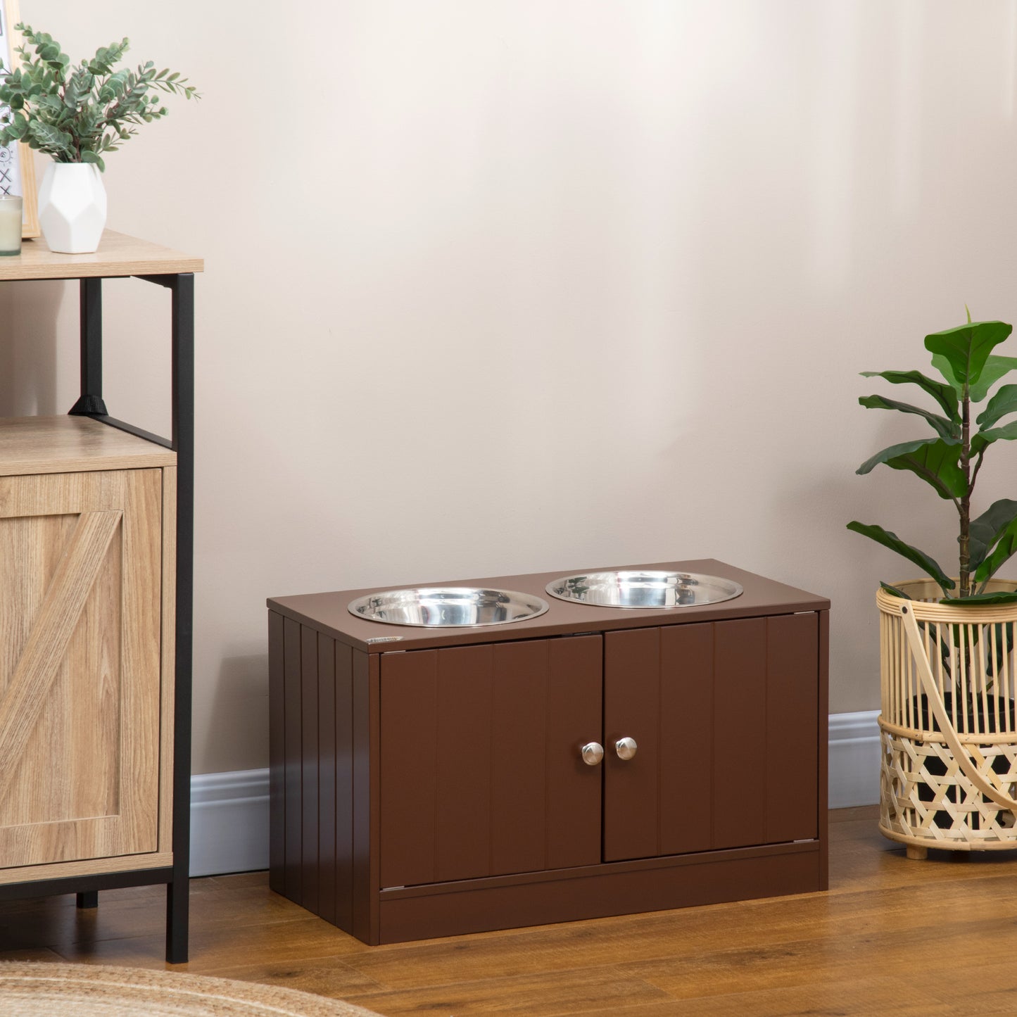 Brown wooden pet feeder station with two stainless steel bowls and cabinet storage