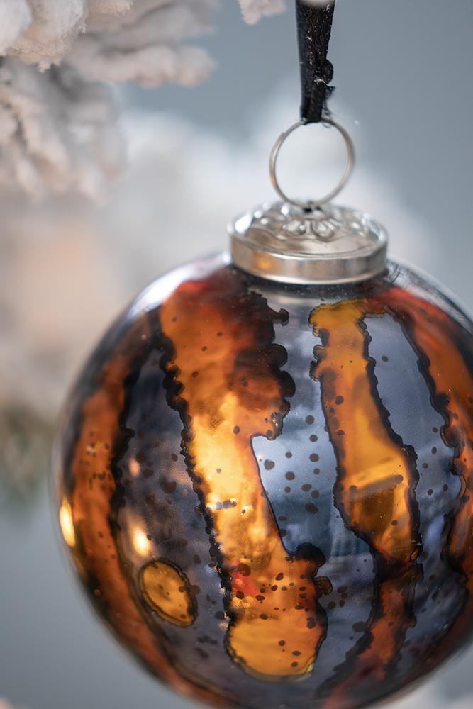 Mercury glass Christmas ornament with amber and charcoal marbling