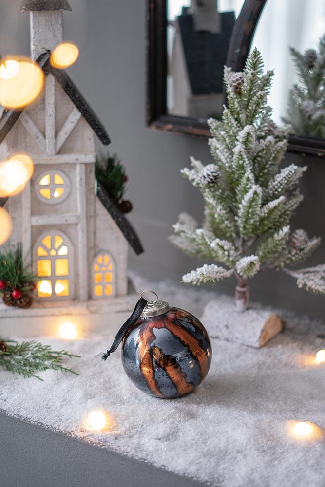 Glass Christmas ornament with copper and dark gray swirls perfect for holiday decor