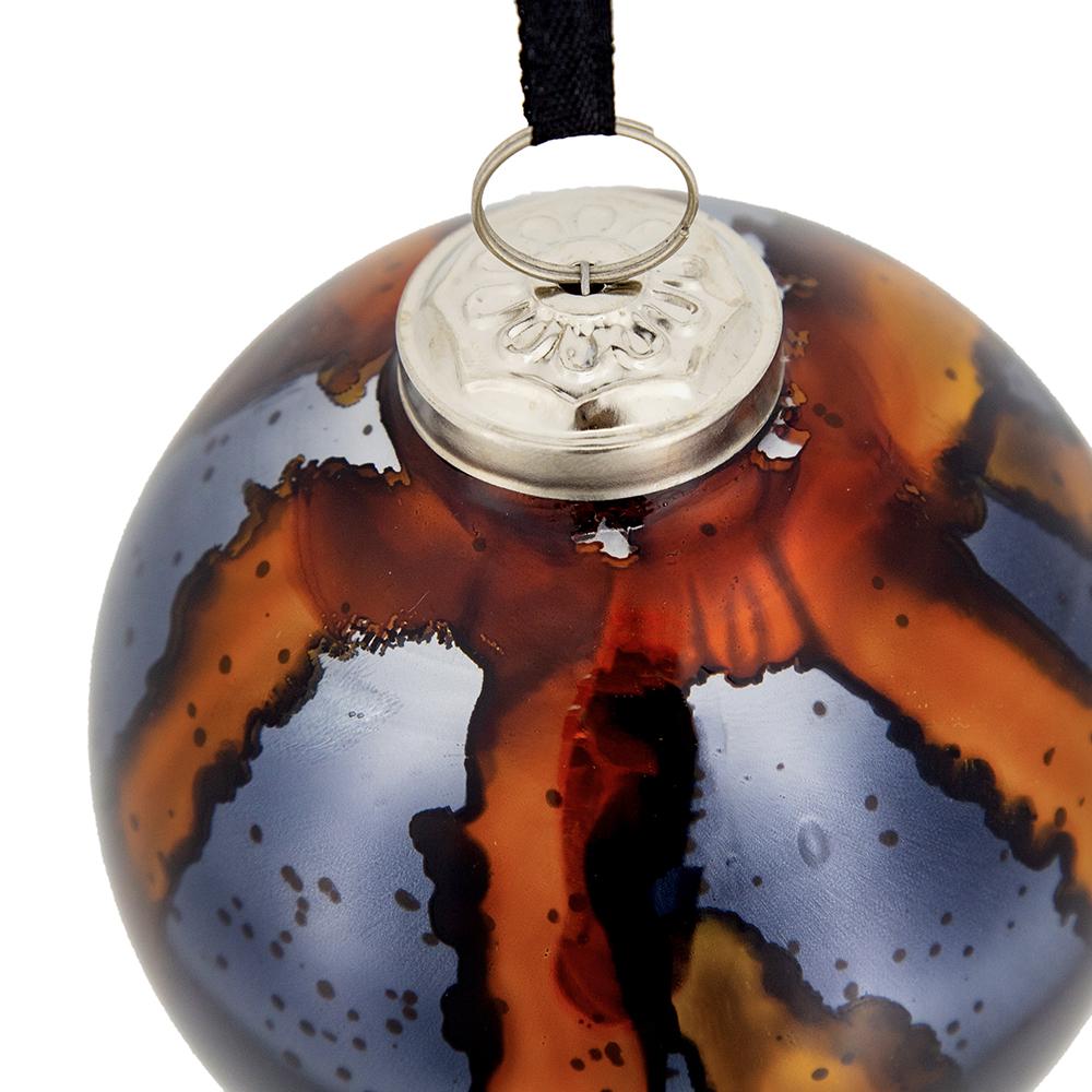 Glass Christmas ornament with amber and gray marbling perfect for festive decor