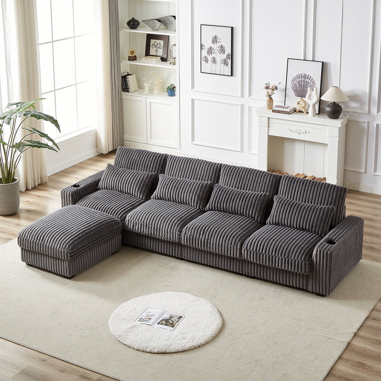 Gray corduroy sectional sofa with chaise and ottoman in a modern living room