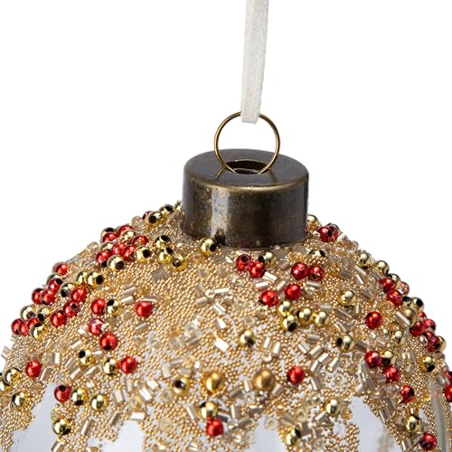 Clear glass Christmas ornament with intricate gold and red beadwork featuring a rustic metal cap