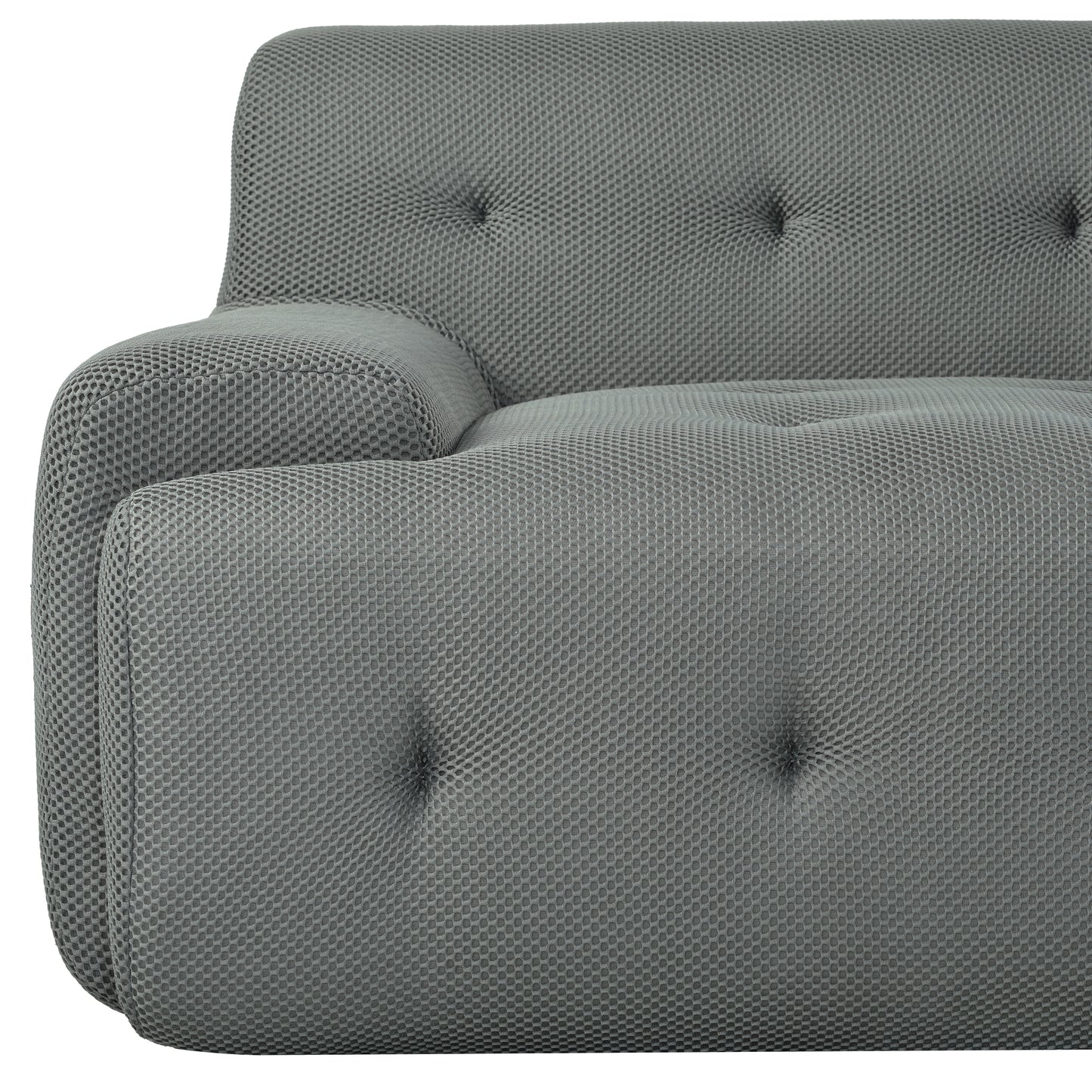 Tufted grey fabric sofa armrest with textured hexagonal pattern