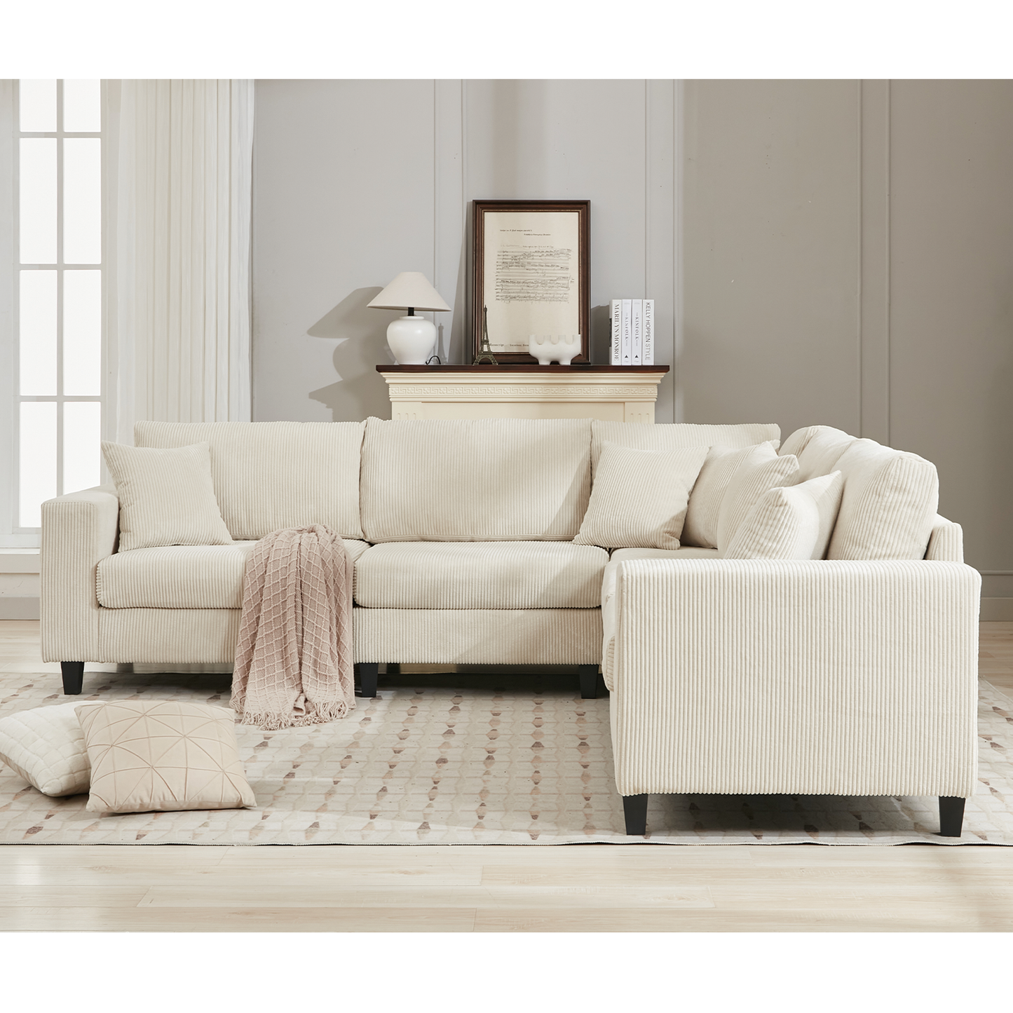 Cream corduroy sectional sofa with plush throw pillows and accent blanket perfect for modern living rooms