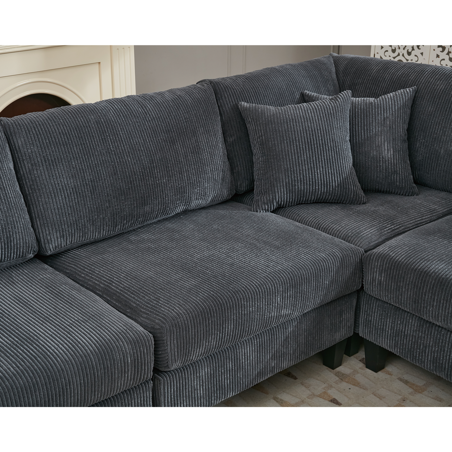 Dark grey corduroy sectional sofa with plush cushions and dark wood legs This sofa offers ultimate comfort for lounging