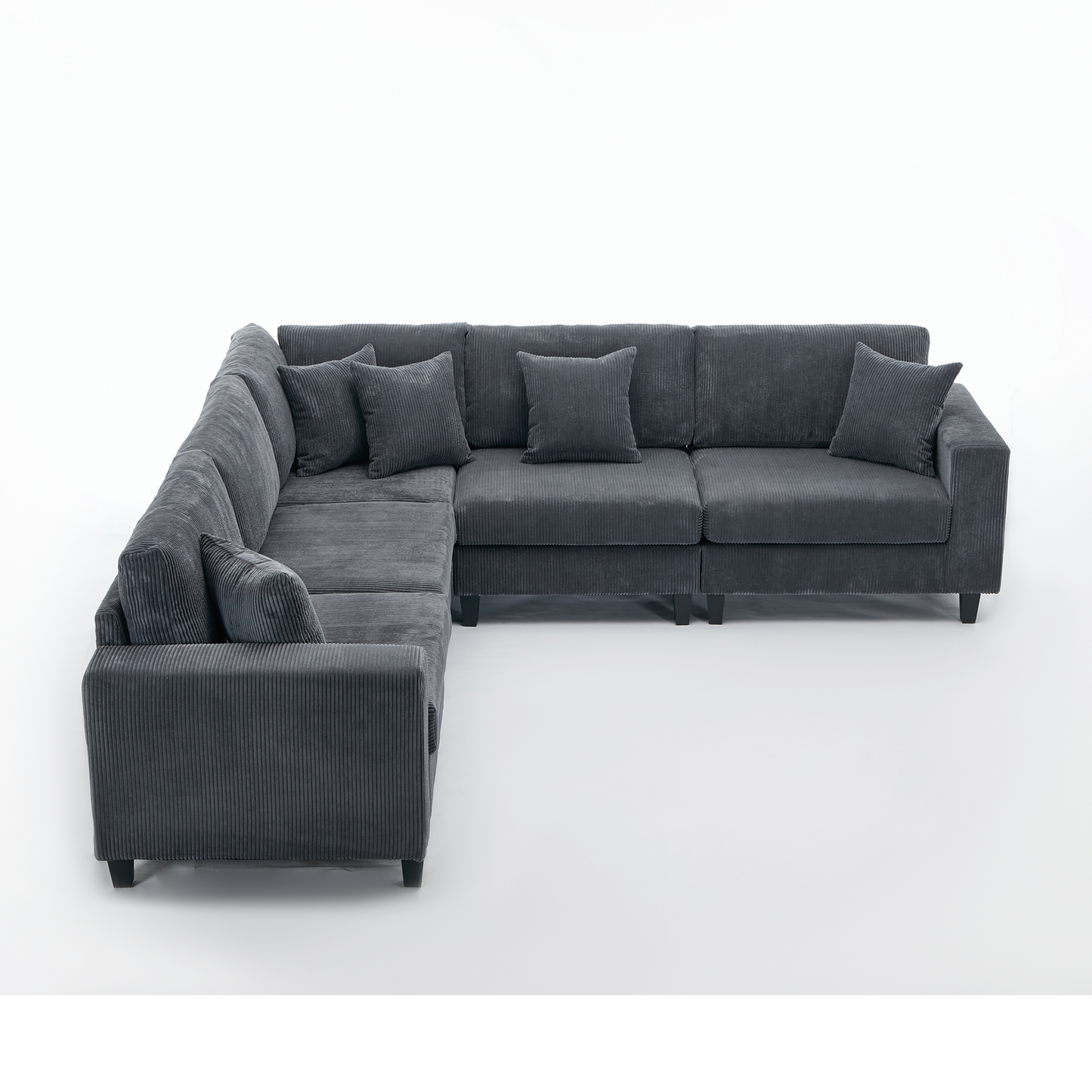 Dark grey corduroy sectional sofa with plush throw pillows for modern living rooms