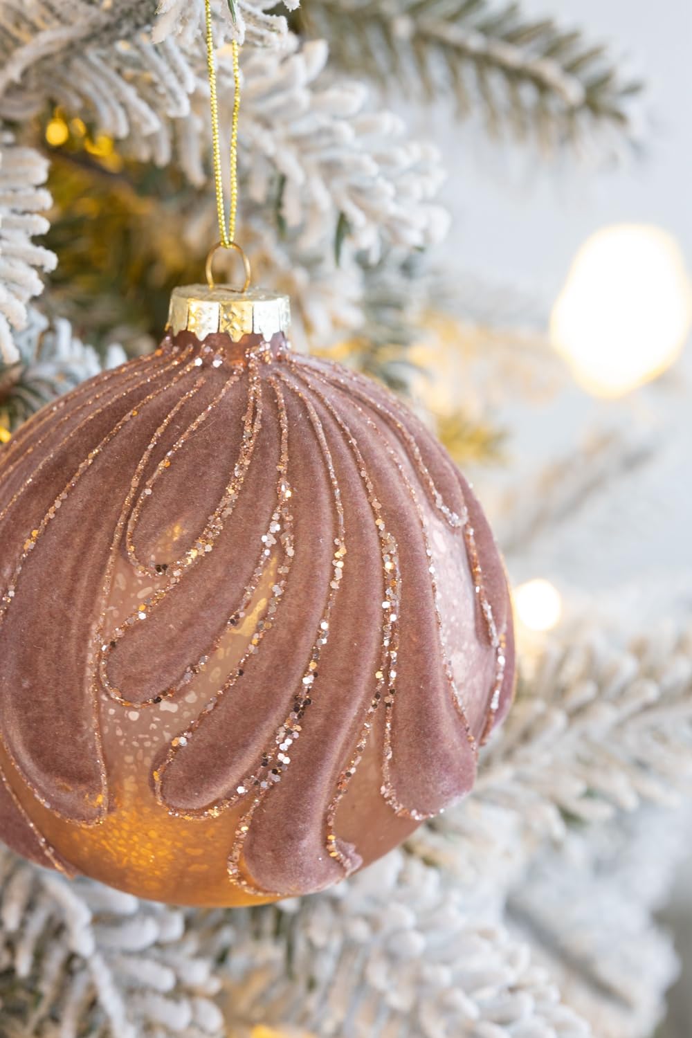 Rose gold velvet Christmas ornament with glitter swirl detail
