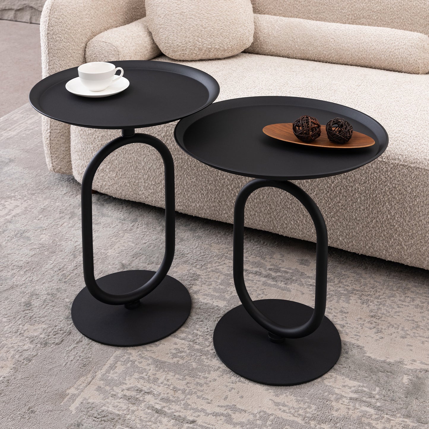 Modern black metal accent tables with oval bases perfect for living room decor