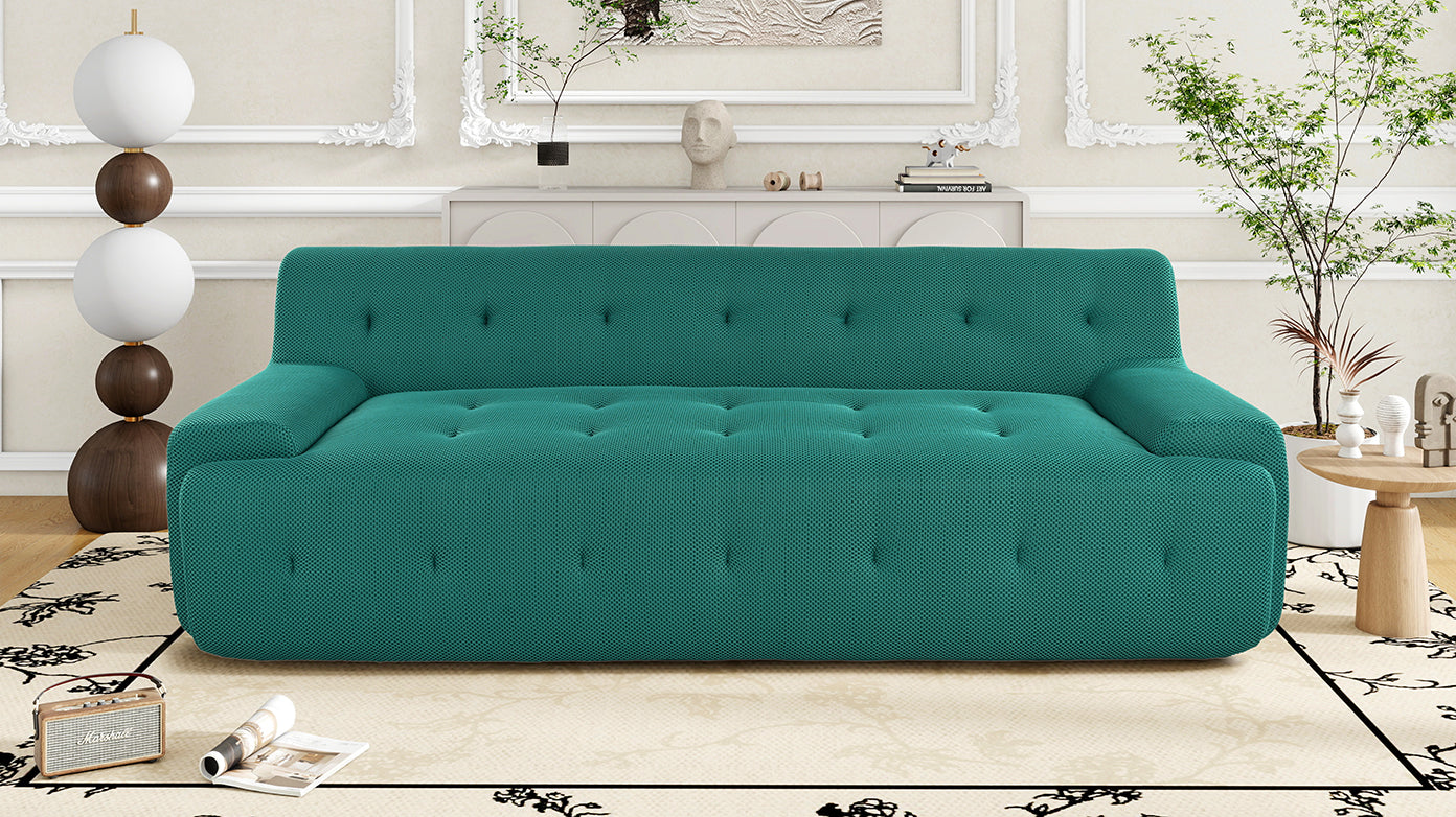 Teal tufted sofa with textured fabric perfect for a modern living room