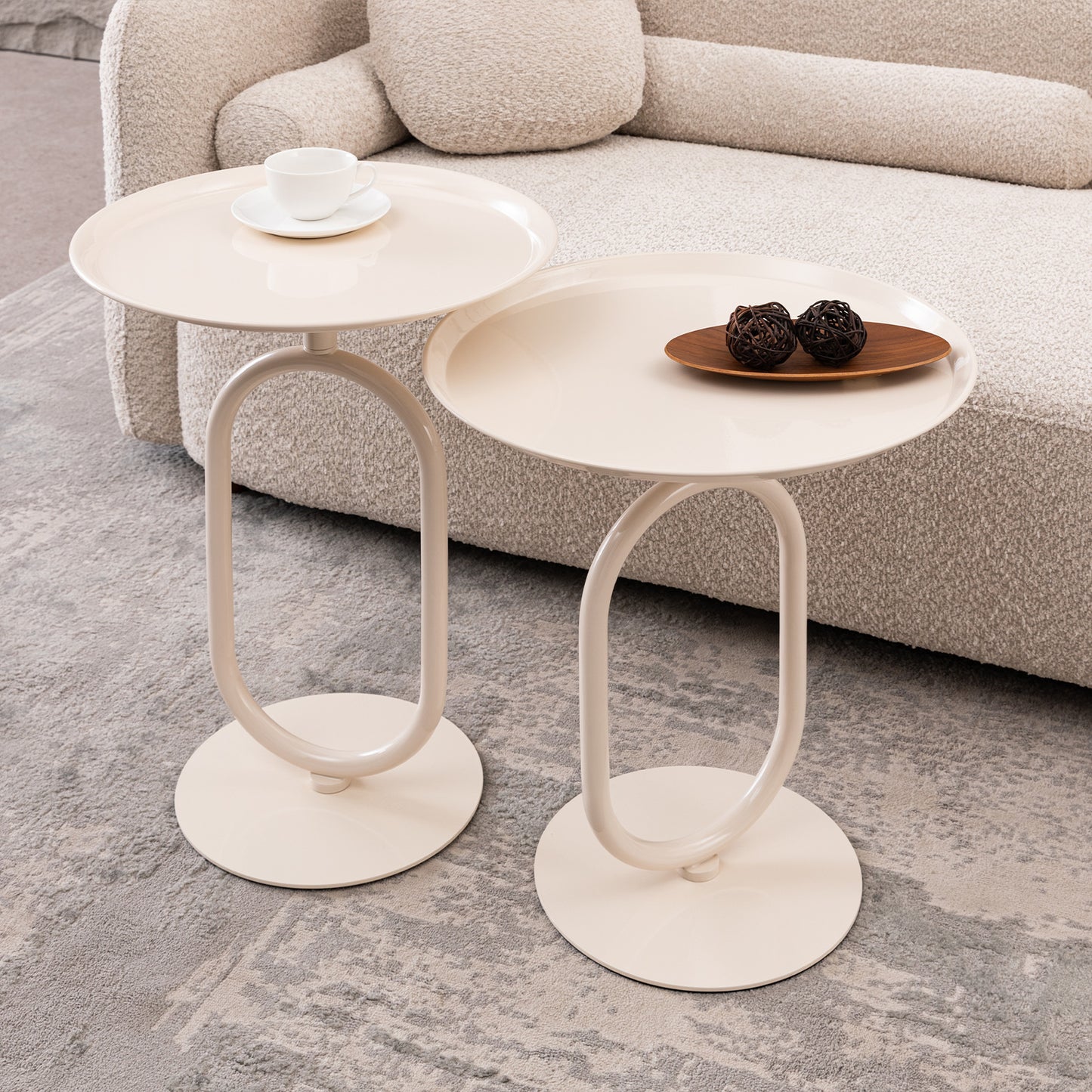 Minimalist cream end table with oval metal base and round tray top