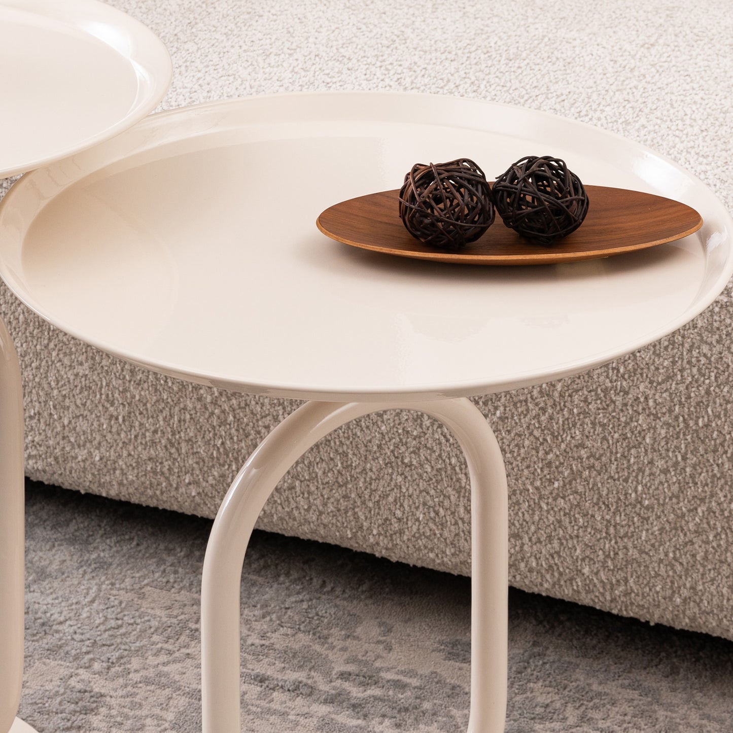 Cream modern accent table with unique curved legs and wooden tray