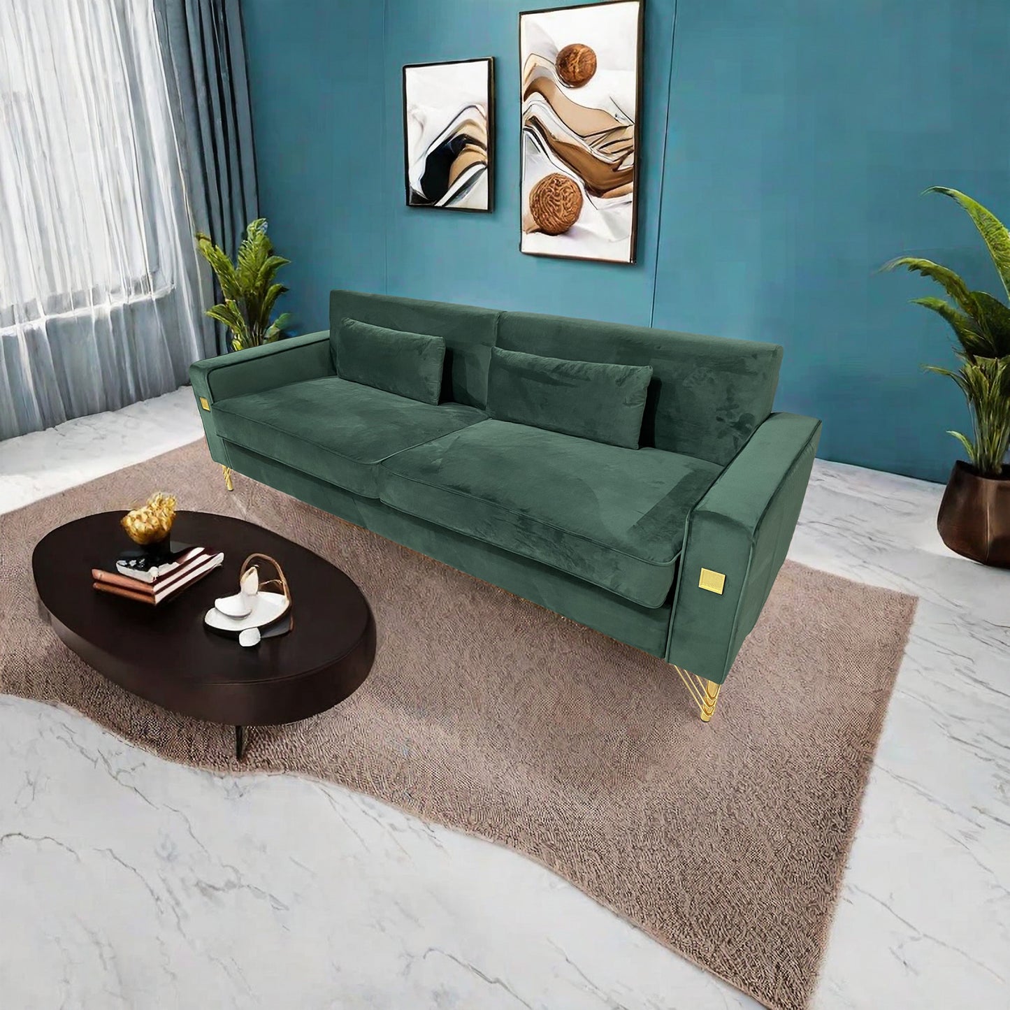 Deep green velvet sofa with gold accents and two throw pillows