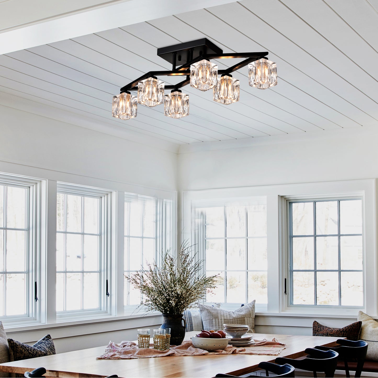 Modern black chandelier with crystal glass shades ideal for dining room lighting