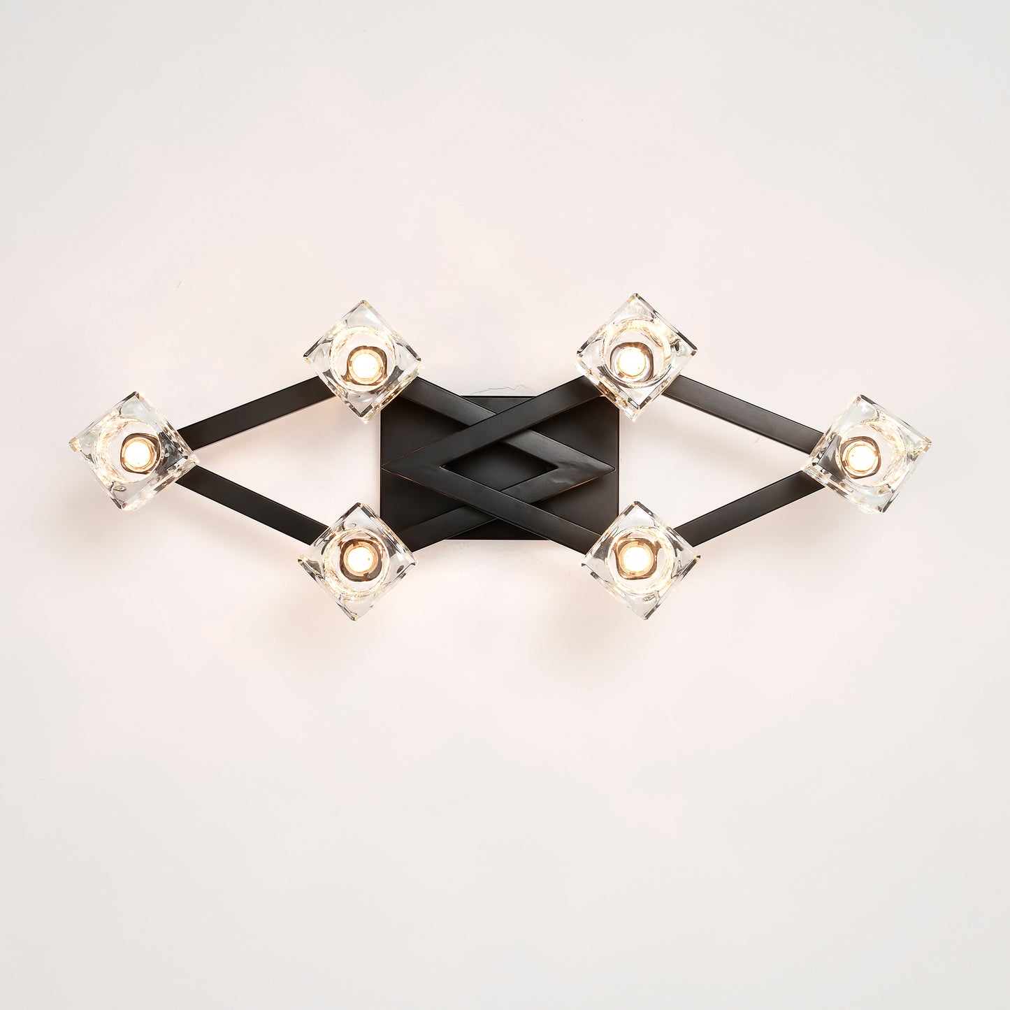 Modern black wall sconce with six crystal cube shades and diamondshaped accent
