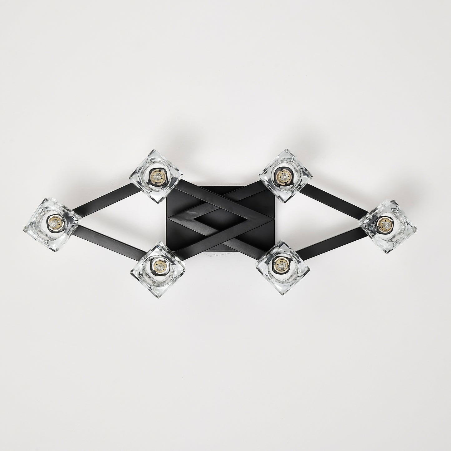 Modern black fixture with crystal cube lights creating ambient ceiling lighting