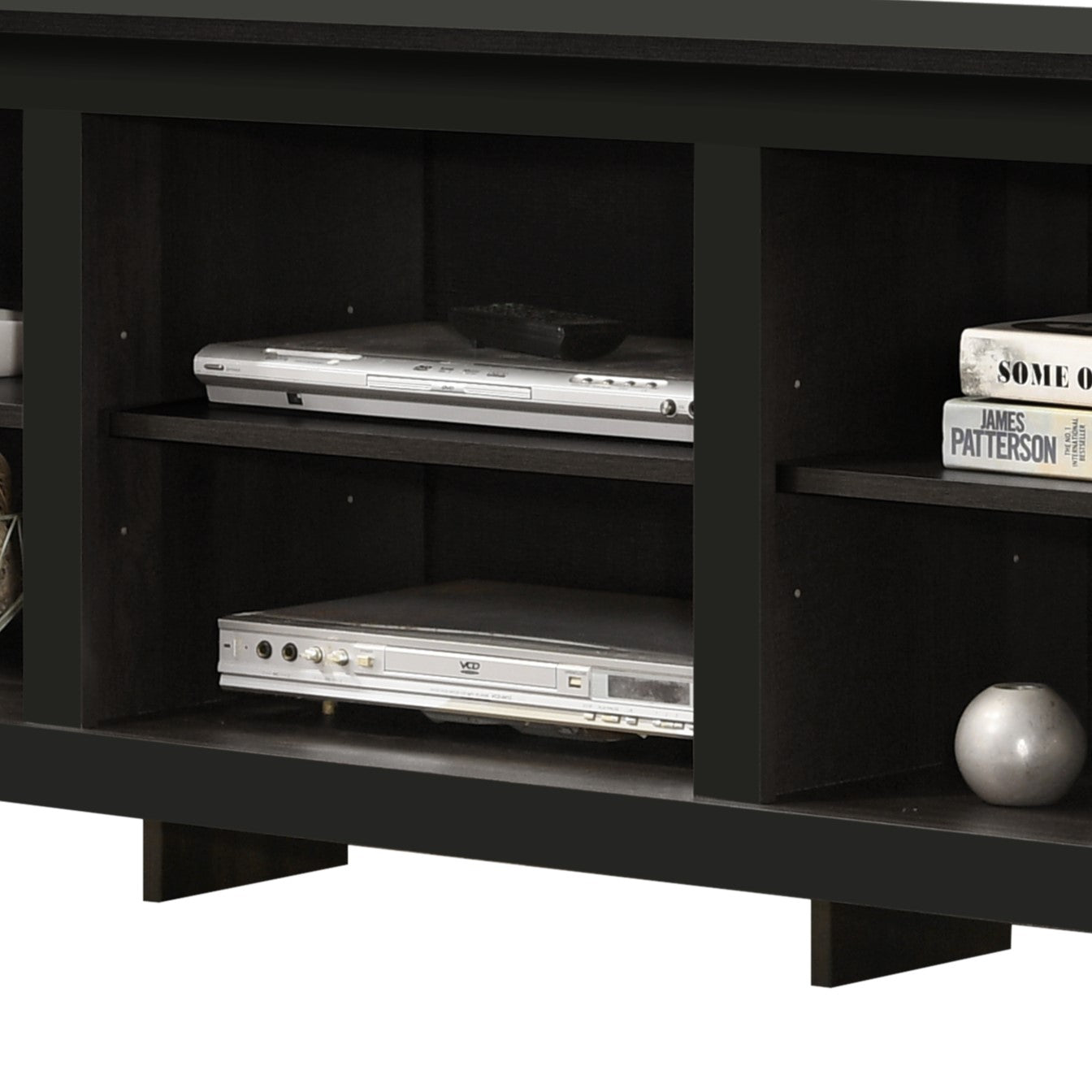 Dark wood media console with two DVD players and a remote control