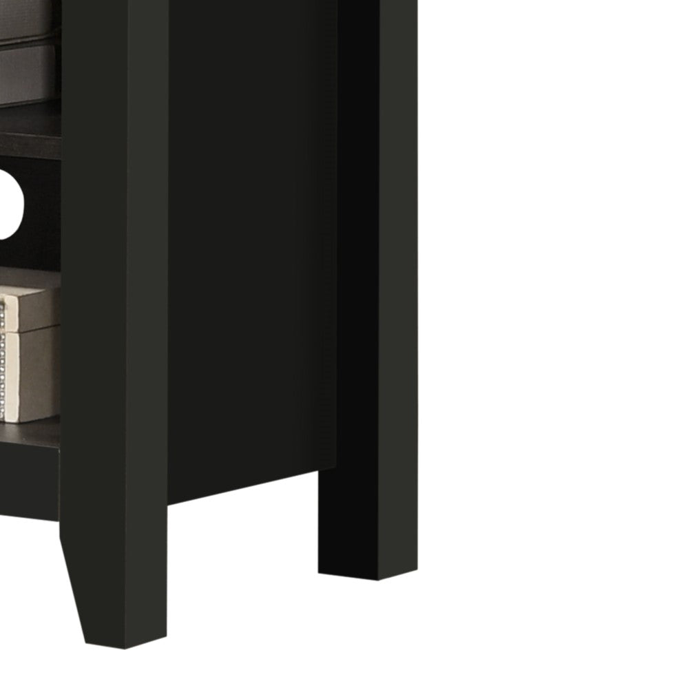 Closeup of a black MDF media console stands sturdy legs and side panel