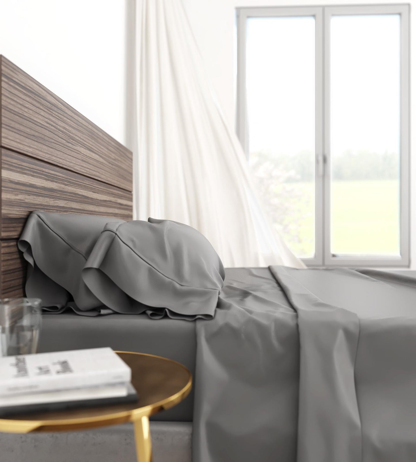 Smooth grey cotton sheets draped elegantly on a bed with a wooden headboard