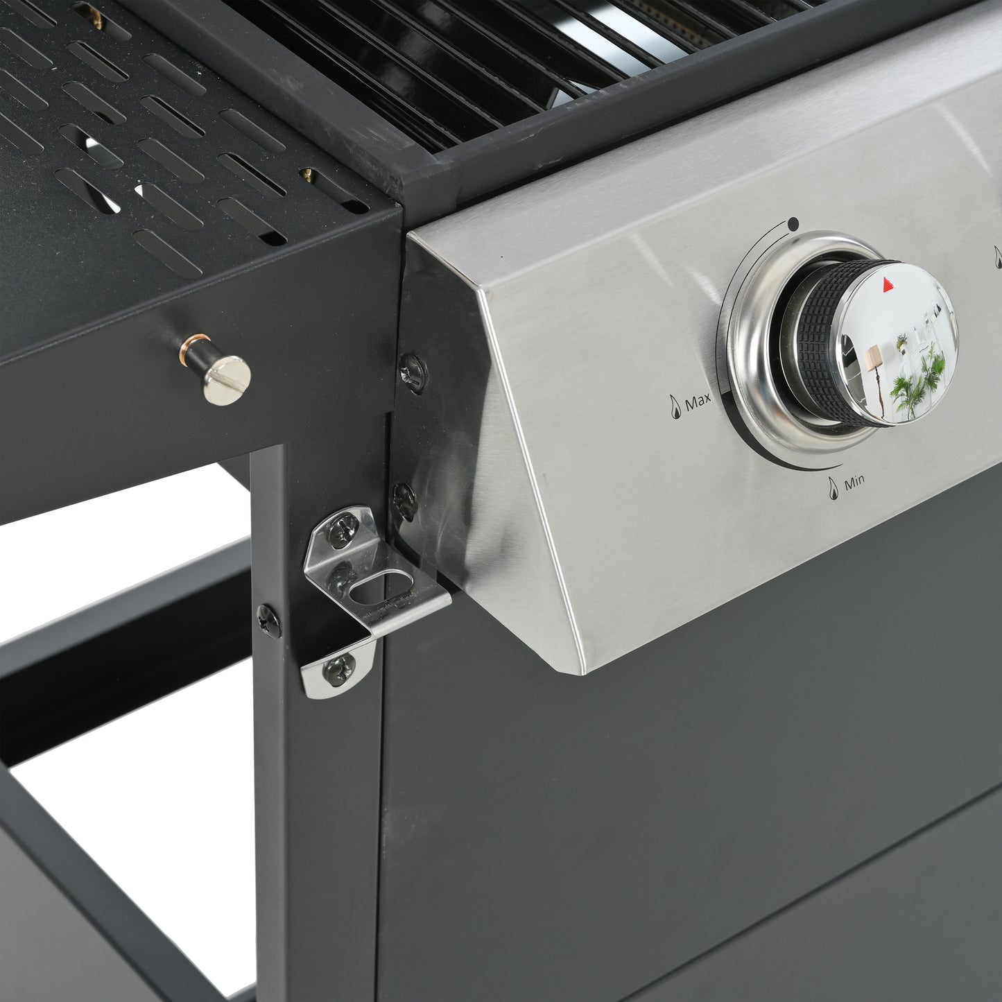 Close up of a stainless steel gas grill control knob with temperature markings