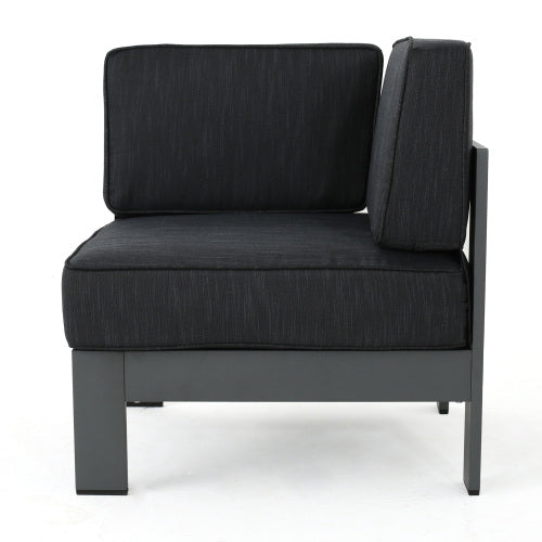 Dark gray outdoor sectional armless chair with textured fabric cushions and metal frame